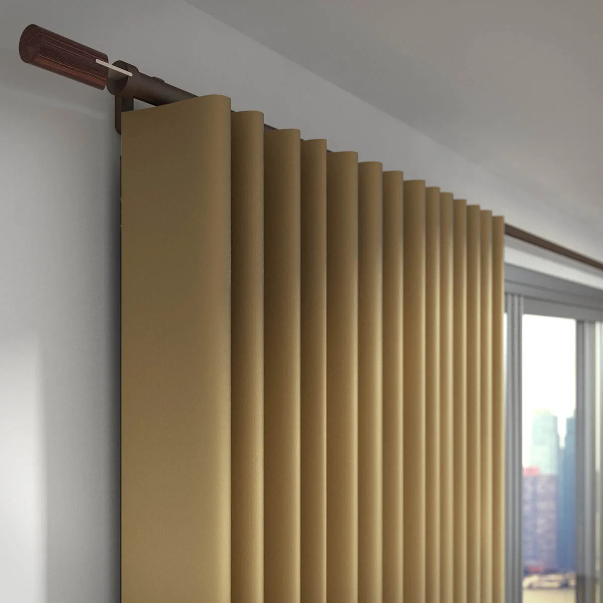 Dark bronze Silent Gliss Metropole pole with a wooden finial, carrying an ochre wave-heading curtain above a city window.